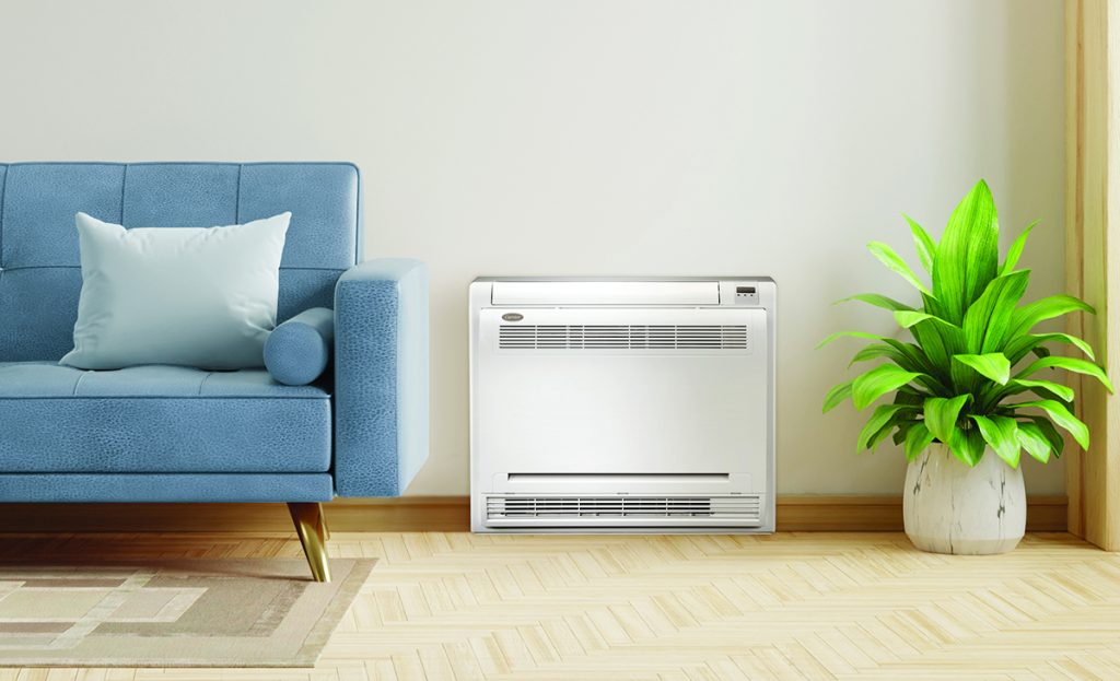 Blue Couch Ductless HVAC In Living Room With Green Plant