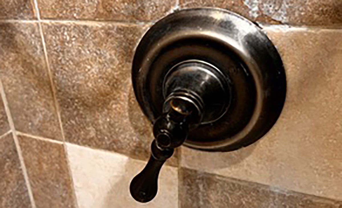 Close Up Of Shower Faucet Handle Turned Downwards