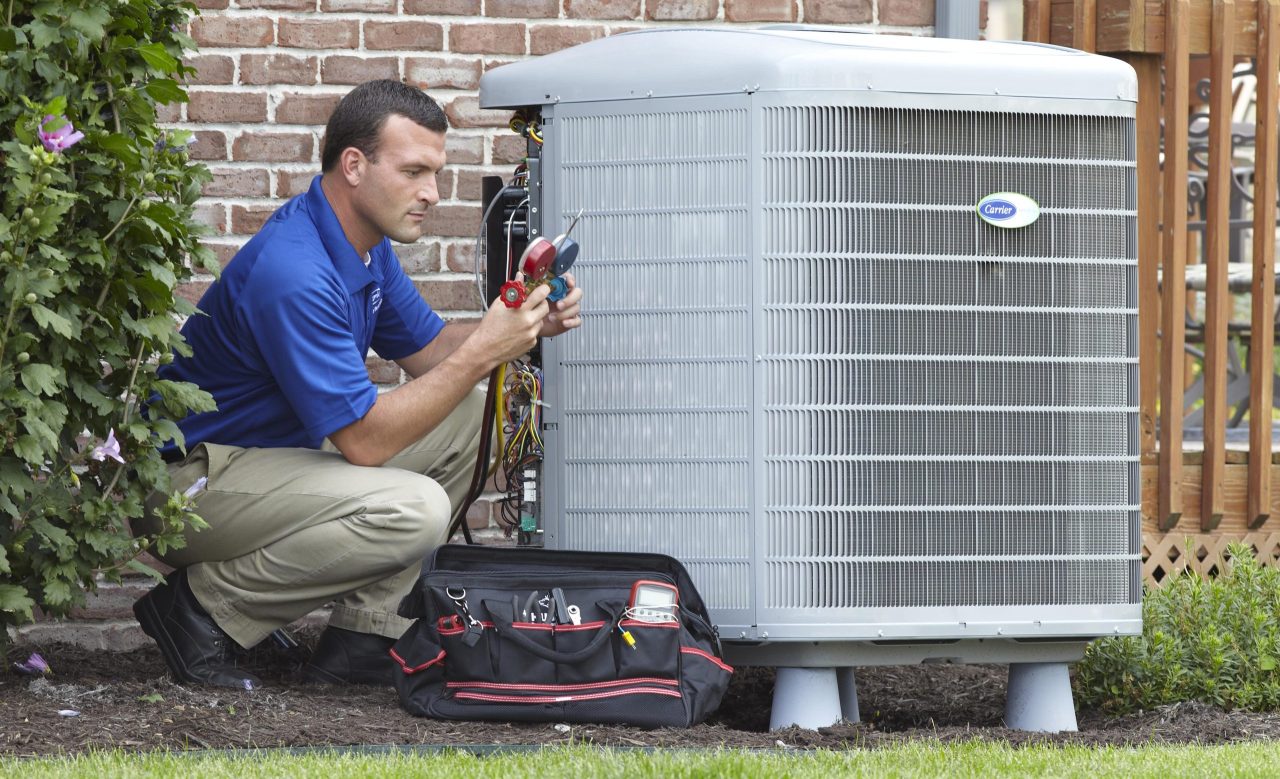 Technician Checking Gauges Outdoor Air Conditioner Unit