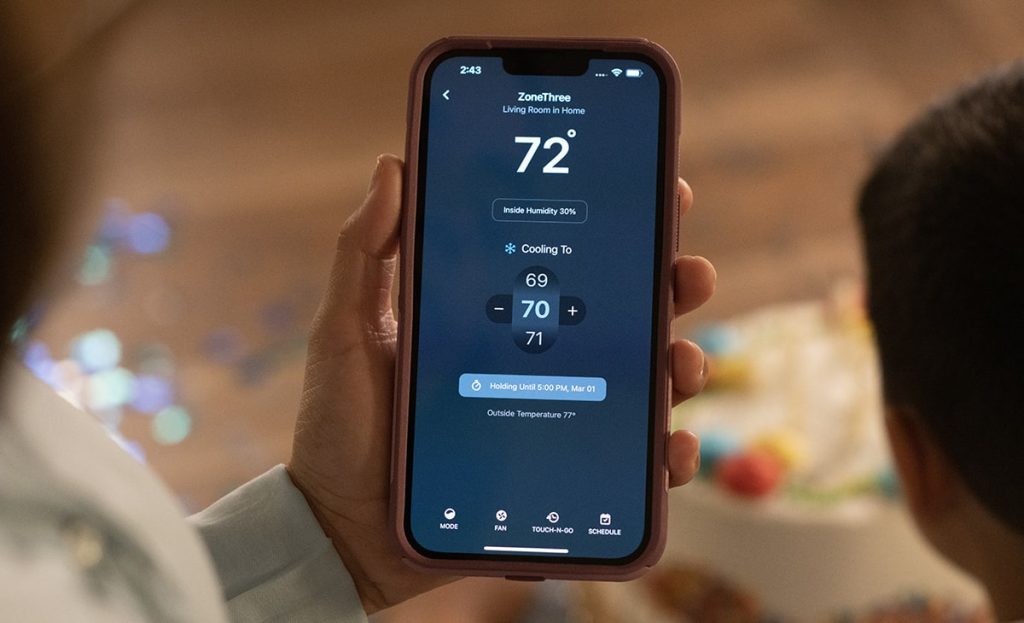 Woman Holding Cellphone In Hand Wifi Thermostat